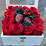 Box of Dozen red roses with festive decoration for new year. Perfect as a gift for yourself or your love ones.